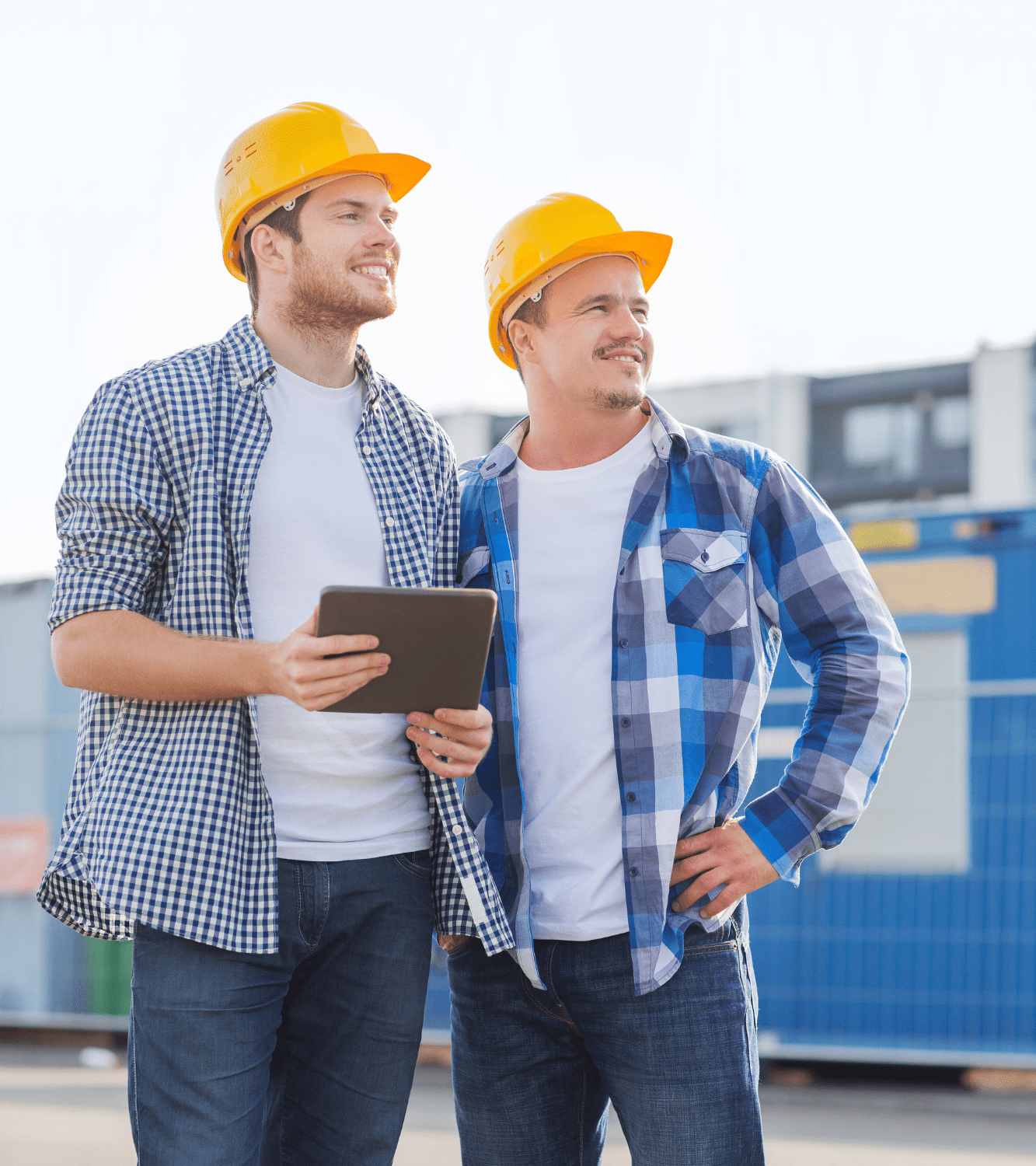 Two Al Arz Construction Company professionals reviewing project plans on-site